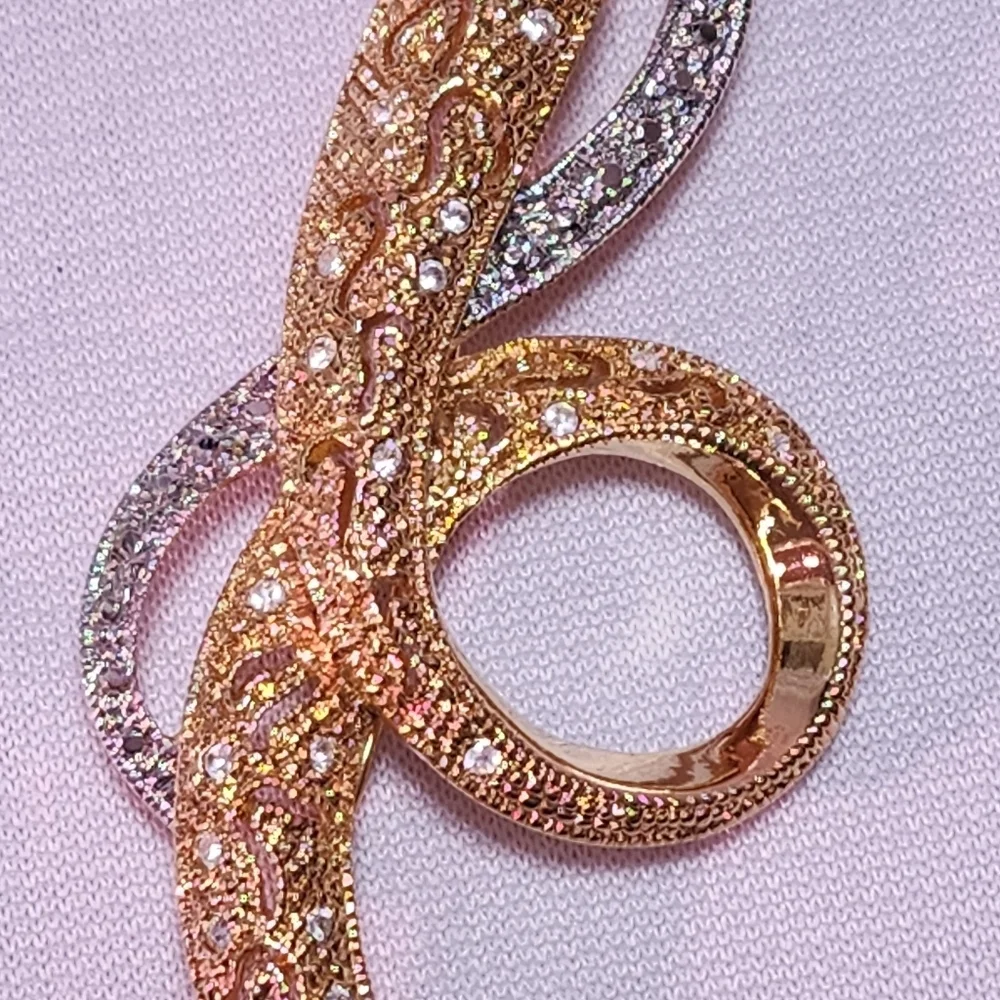 Avon Silver and Gold Tone Swirl Brooch with Rhinestones